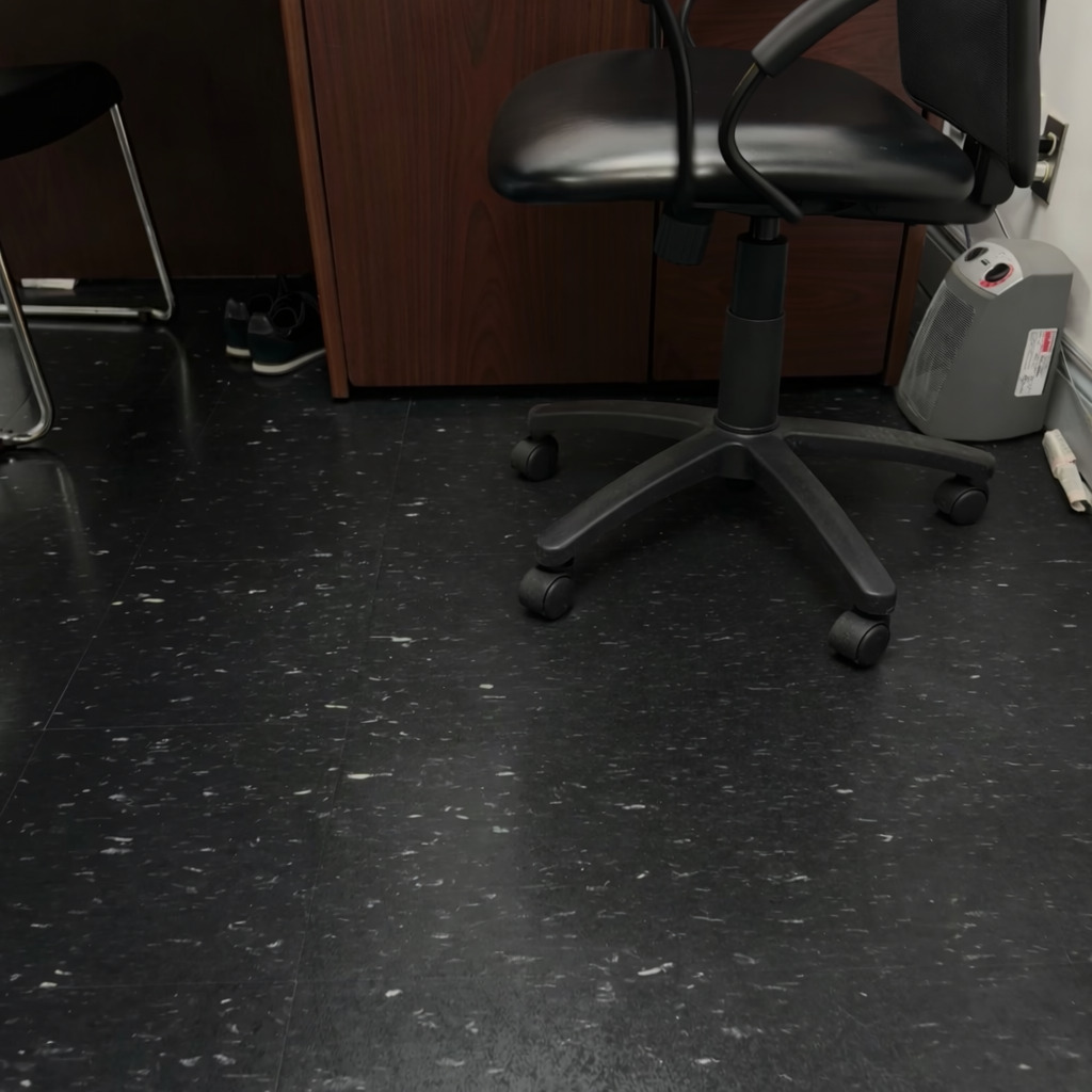 Office workspace floor restored to a glossy finish